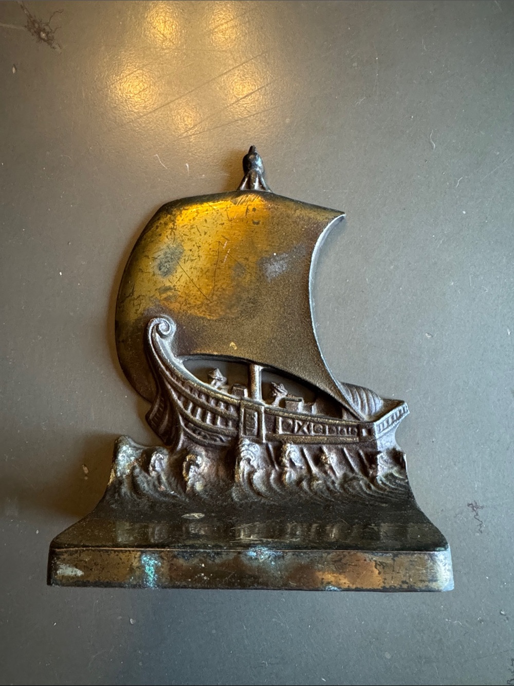 Single vintage bronze bookend